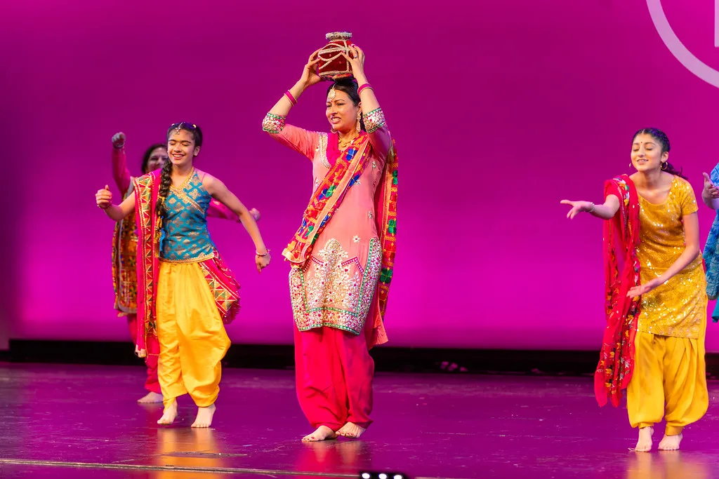 Bhangra Empire performers celebrating fresh choreography