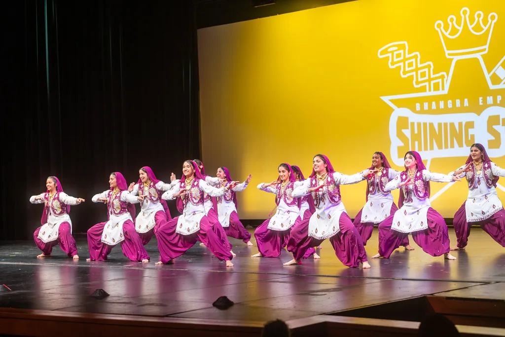 Bhangra Empire team performing live on stage